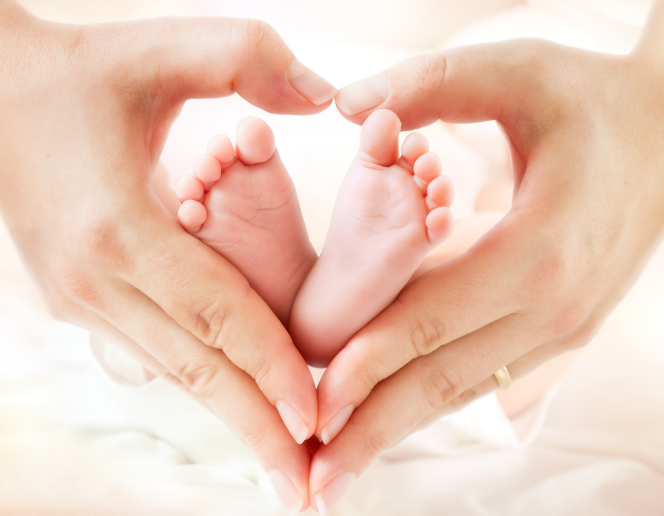 Babies feet in mums hands